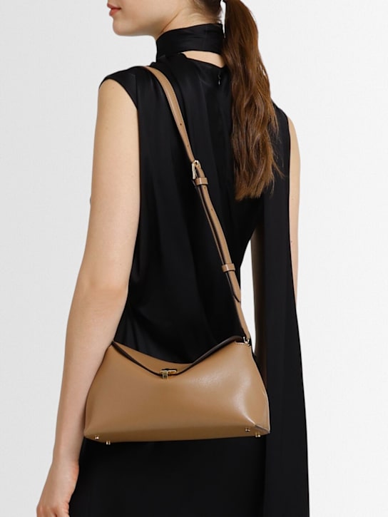 Toteme T-Lock palmellata leather clutch